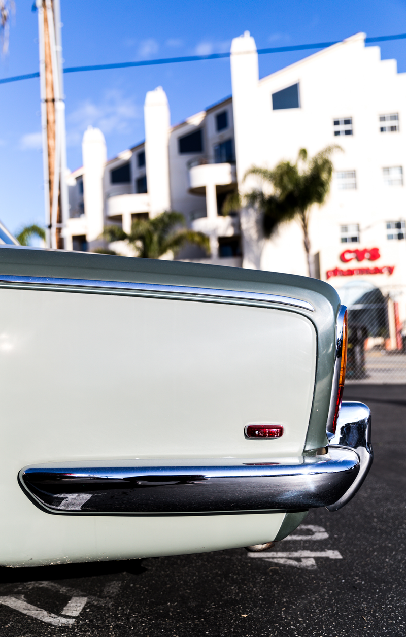Clean-ass old Rolls Royce, just parked in a random lot by the beach.